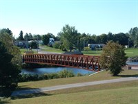 Erected by Acts II Construction; This LAFA project included the construction of a 240 foot single span pedestrian bridge spanning the Oswegatchie River connecting Harry L. Mills Memorial Park with the Riverview Recreation Park